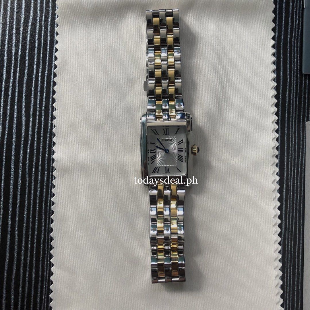 Seiko Classic Tank SWR087 (Category: Women's Watches) located in Santa Rosa. Submitted by sha.mnl (Listing ID 1440893554, Image 2). Description: Seiko Classic Tank Two-Tone Gold Caliber Number: 4N30 Movement Type: Quartz Thickness: 7.2mm Diameter: 22.2mm Lug-to-lug: 33.1mm Crystal: Hardlex Clasp: Three-fold clasp with push button release Distance between lugs: 16mm Brand New. Original from Japan 🇯🇵 📍Nueva Ecija.