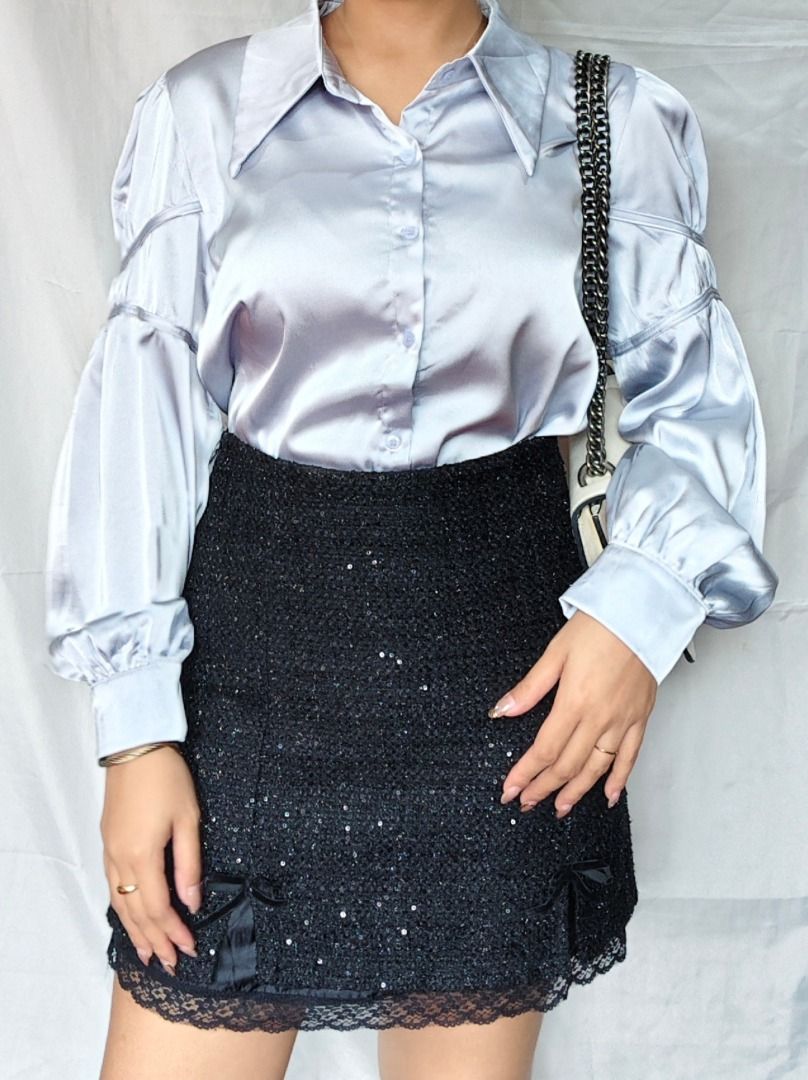 Silver Blue Silk-Feel Collared Button Up | Corporate Chic - Event Wear (Category: Blouses) located in Echague. Submitted by arriettyedit (Listing ID 1440834405, Image 2). Description: Light blue satin shirt. Has a pointed collar and button-up front. Features dramatic puff sleeves with gathered details. Looks great tucked into a skirt or high-waisted pants. Comfortable and stylish for any occasion..