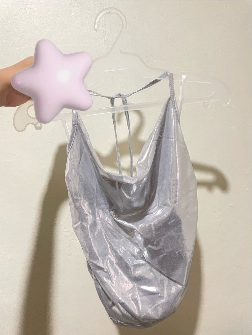 Silver Metallic Ruched Halter Neck Tie Top (Category: Sleeveless) located in Manila. Submitted by ldhlvr (Listing ID 1440846114, Image 2). Description: metallic cow lick and backless top - like new, worn once for a concert - size M - very flattering when worn! (hard to take a pic lang when hanged but I can send pic when worn po) - Eye-catching shiny silver halter top - Elegant cowl neck design - Flattering ruched detailing all over - Secure tie-b