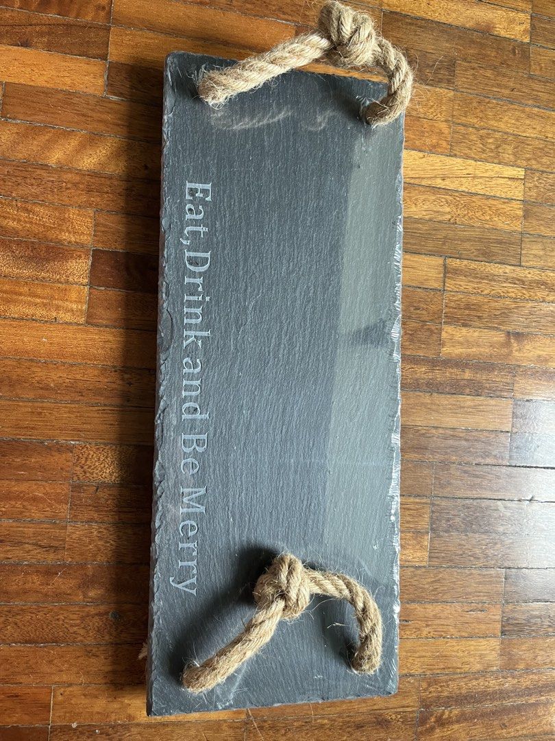Slate Serving Tray (Category: Other Kitchenware & Tableware) located in Muntinlupa City. Submitted by projectnoclutter (Listing ID 1440807599, Image 2). Description: - Brand: Eurochef - Material: Natural Slate - Features: Engraved 'Eat, Drink and Be Merry', Jute rope handles - Dimensions: 38x15 cm (15"x5.9") - Condition: Excellent - Ideal for serving cheese, crackers, appetizers, and more..