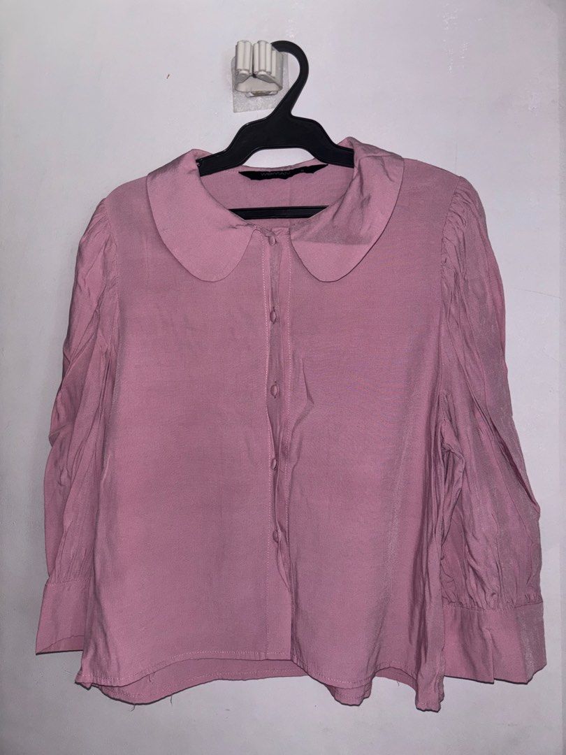 SM Woman Pink Peter Pan Collar Button Up Blouse (Category: Blouses) located in General Trias. Submitted by r_bimil (Listing ID 1440950413, Image 1). Description: - Adorable pink blouse with a charming Peter Pan collar. - Features a classic button-up front. - Slightly puffed sleeves gathered at the cuff for a touch of detail. - Designed for a relaxed, comfortable fit. - Versatile for casual outings or adding a polished touch to your outfit. - Effo