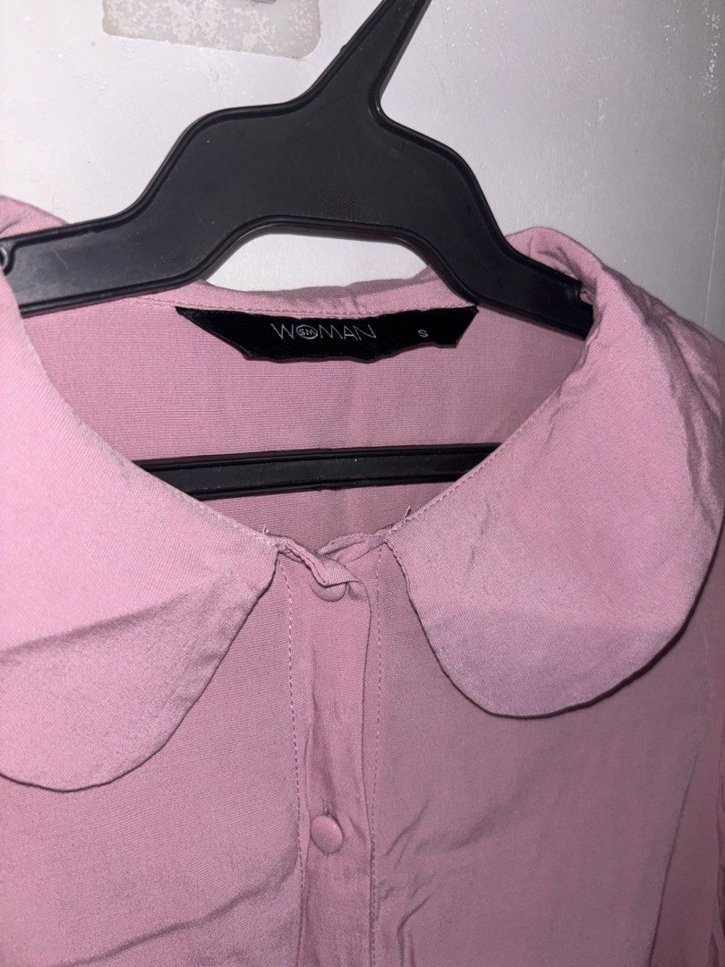 SM Woman Pink Peter Pan Collar Button Up Blouse (Category: Blouses) located in General Trias. Submitted by r_bimil (Listing ID 1440950413, Image 2). Description: - Adorable pink blouse with a charming Peter Pan collar. - Features a classic button-up front. - Slightly puffed sleeves gathered at the cuff for a touch of detail. - Designed for a relaxed, comfortable fit. - Versatile for casual outings or adding a polished touch to your outfit. - Effo