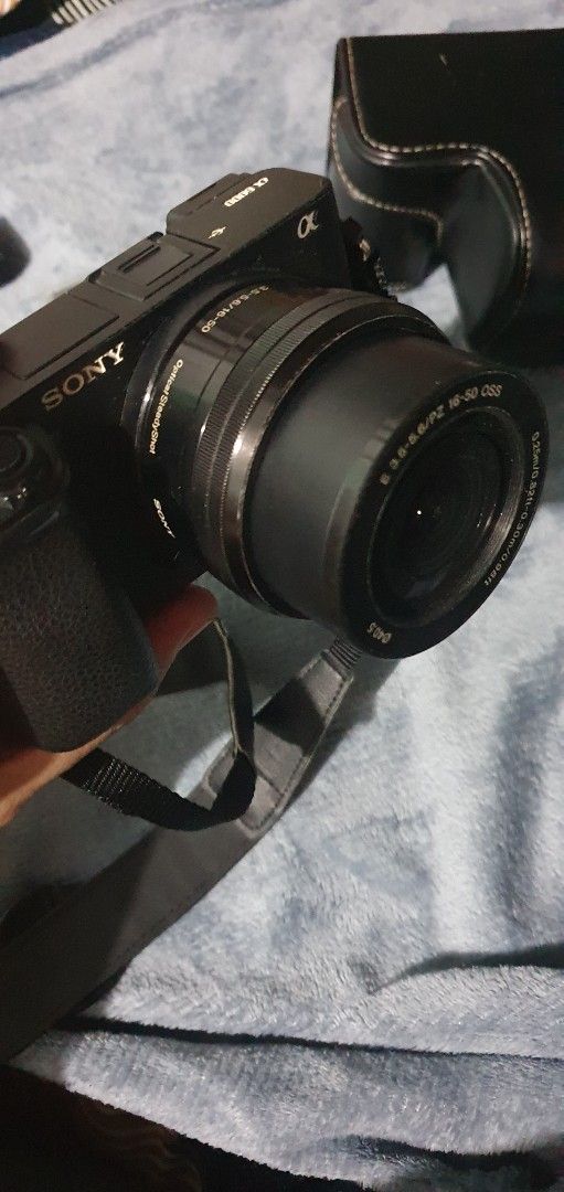 Sony Alpha A6000 with 16-50mm Lens (Category: Cameras) located in Dasmarinas. Submitted by djoko77 (Listing ID 1440766778, Image 2). Description: - Sony Alpha mirrorless camera A6000 - E PZ 16-50mm OSS lens included - Comes with a camera bag - Includes Sony original battery and charger - Perfect beginner's camera - Shutter count 29.7K - No memory card Freebies: - Leather camera bag with strap - 2 Smallrig batteries and charger Issues: - Minor scr
