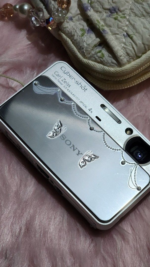 Sony Cybershot DSC T110 in silver (Category: Cameras) located in Rizal. Submitted by kaj18 (Listing ID 1440872612, Image 2). Description: ~Sony Cybershot DSC T110 in Silver!- Price:6,500 fixed Specs: 16.1 megapixels lens type: Carl Zeiss Vario-Tessar 4x optical zoom - All working: flash, zoom, video, audio, zoom button, power on/off - Body cosmetics: 9/10 (light screen scratches from signs of usage) - no lens dust - Issue: color tones are slightl