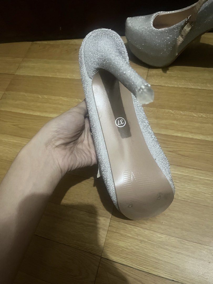 Sparkly Silver Platform Heels with Ankle Strap (Category: Heels) located in Santa Rosa. Submitted by mo0chimi (Listing ID 1440892700, Image 3). Description: - silver glitter heels - tried only once, never been used. good as new.