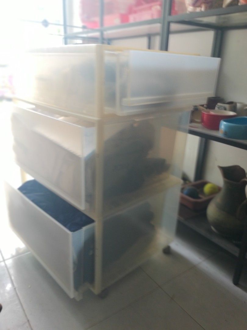 Stackable Translucent Plastic Storage Drawers (Category: Storage Boxes & Baskets) located in Singapore. Submitted by petstudio77 (Listing ID 1440672554, Image 2). Description: - Stackable storage drawers - Translucent plastic design - Easy slide-out drawers - Ideal for organizing clothes, accessories, and more - Space-saving solution for closets comes with moving wheels..