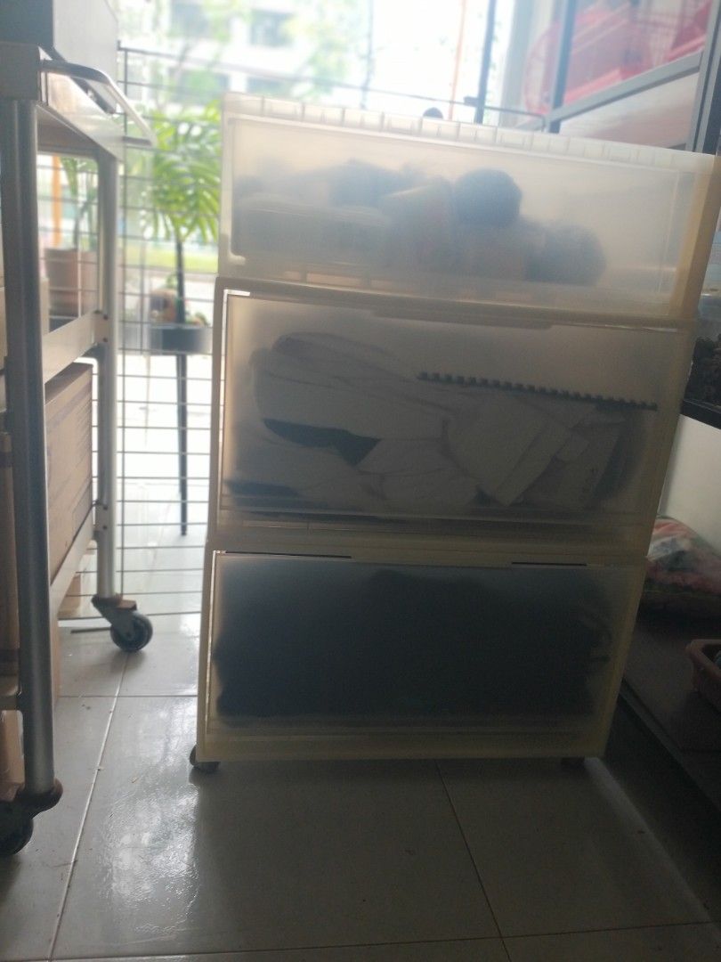 Stackable Translucent Plastic Storage Drawers (Category: Storage Boxes & Baskets) located in Singapore. Submitted by petstudio77 (Listing ID 1440672554, Image 3). Description: - Stackable storage drawers - Translucent plastic design - Easy slide-out drawers - Ideal for organizing clothes, accessories, and more - Space-saving solution for closets comes with moving wheels..