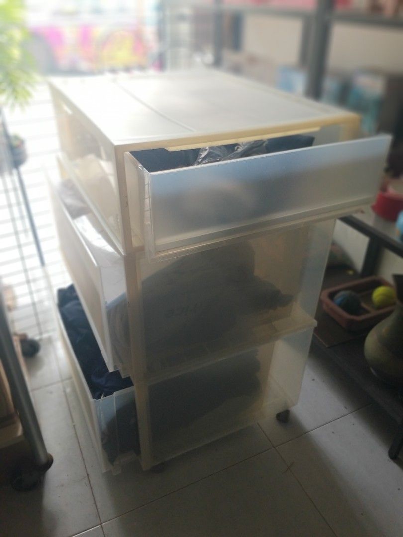 Stackable Translucent Plastic Storage Drawers (Category: Storage Boxes & Baskets) located in Singapore. Submitted by petstudio77 (Listing ID 1440672554, Image 1). Description: - Stackable storage drawers - Translucent plastic design - Easy slide-out drawers - Ideal for organizing clothes, accessories, and more - Space-saving solution for closets comes with moving wheels..