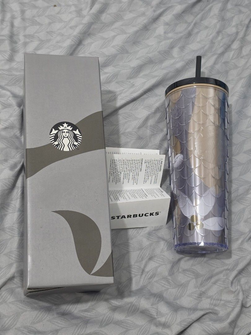 Starbucks Tumbler with Box (Category: Water Bottles & Tumblers) located in Binan City. Submitted by nel.geronimo (Listing ID 1440783955, Image 1). Description: - Authentic Starbucks Tumbler - Unique textured design in purple and gold - Comes with original box - Includes black straw - Ideal for your everyday beverages.