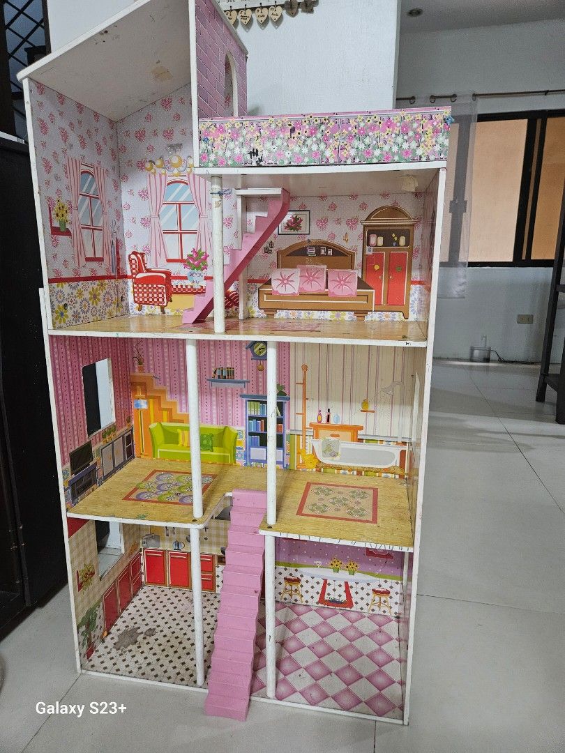 Super sale!Plum Tillington Large Wooden Dollhouse with Furniture (Category: Toys & Games) located in Quezon City. Submitted by all200andbelow (Listing ID 1440870529, Image 1). Description: - as is condition. pickup at commonwealth ave qc. or lalamove van -Spacious dollhouse with multiple rooms and levels. - Includes built-in furniture: beds, bathtub, kitchen cabinets. - Adorable pink and floral wallpaper decoration. - Features stairs and balconie