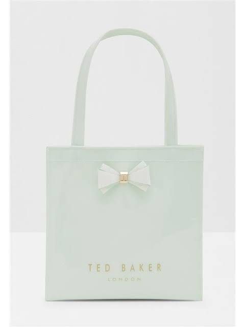Ted Baker Alacon Plain Bow Large Icon Tote / Top handle Bag (Category: Luxury Bags & Wallets) located in Muntinlupa City. Submitted by secondemain.ph (Listing ID 1440812372, Image 1). Description: •Mint Green Color •Glossy PVC Material •Gold-tone hardware •36cm L x 9cm W x 37cm H •Top handle with 20cm drop •Refer to photos 5 onward for actual photos of item on hand •RFS: downsizing AUTHENTICITY GUARANTEED I only sell authentic products from verif