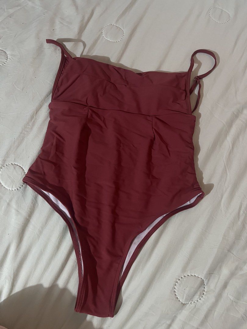 Terracota One-Piece Swimsuit (Category: Bikinis & Swimsuits) located in Antipolo. Submitted by tomale1 (Listing ID 1440800884, Image 1). Description: - Stylish maroon one-piece swimsuit - Elegant square neckline with thin straps - Flattering ruching detail at the waist - Chic high-cut leg design - Perfect for beach or pool outings.