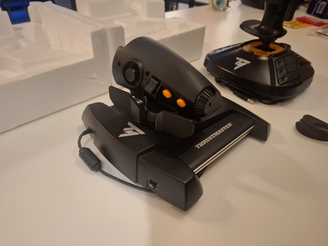 ThrustMaster T6000 controllers (Category: Controllers) located in Singapore. Submitted by underscoreblank (Listing ID 1440823740, Image 3). Description: Used once or twice. Lost the packaging box but would sell with the styrofoam. HDMI cables. Bought for $230 and don't really play aviation games anymore.