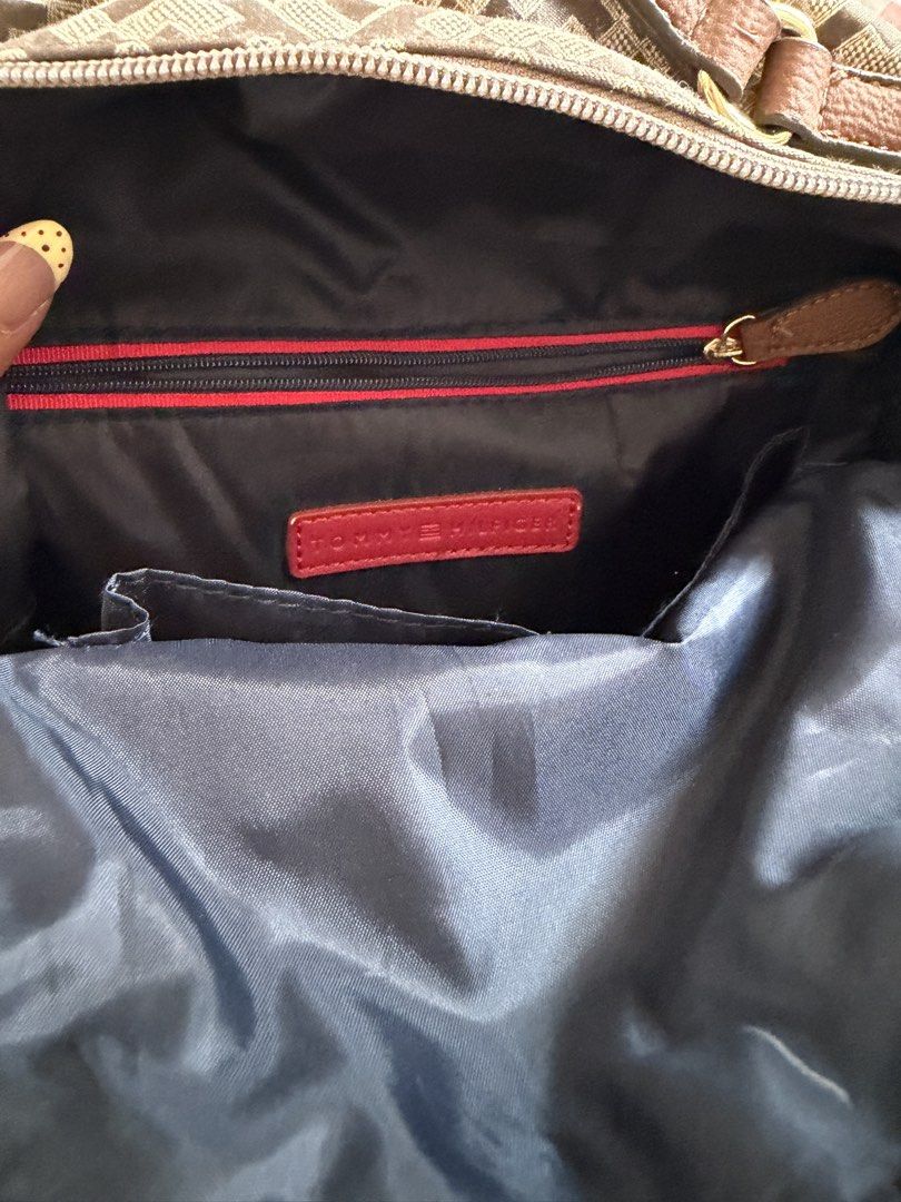 Tommy Hilfiger Monogram Canvas Backpack (Category: Backpacks) located in Manila. Submitted by chiechums (Listing ID 1440795361, Image 2). Description: - Authentic Tommy Hilfiger backpack - Classic tan and brown all-over monogram print - Stylish leather trim and strap details - Spacious main compartment with interior zip pocket - Smooth, reliable zippers - Ideal for everyday use, school, or travel.