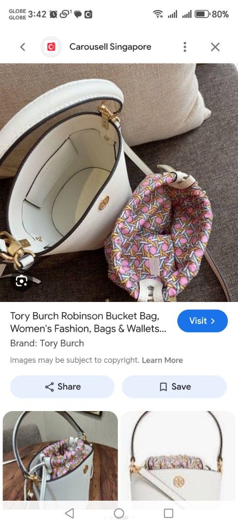 Tory Burch Robinson Bucket Bag White (Category: Luxury Bags & Wallets) located in Santa Rosa. Submitted by RRRR0520 (Listing ID 1440835567, Image 1). Description: - Authentic Tory Burch Robinson bucket bag in white. - Features a colorful patterned drawstring interior. - Minor marks and scuffs on the exterior and base. - Handle shows some signs of wear. - Still a charming and stylish bag..