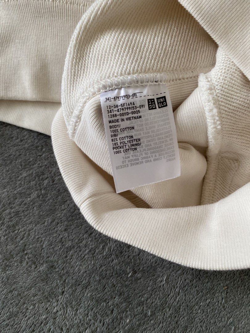 Uniqlo Cream Half Zip Sweatshirt (Category: Coats, Jackets and Outerwear) located in Barili. Submitted by macheyzhackiel (Listing ID 1440776693, Image 3). Description: - Cream-colored Uniqlo sweatshirt - Half zip neckline with stand-up collar - Two side pockets - Ribbed cuffs and hem - Made in Vietnam - Material: 80% Cotton, 20% Polyester (Body); 82% Cotton, 18% Polyester (Rib); 100% Cotton (Pocket Lining).