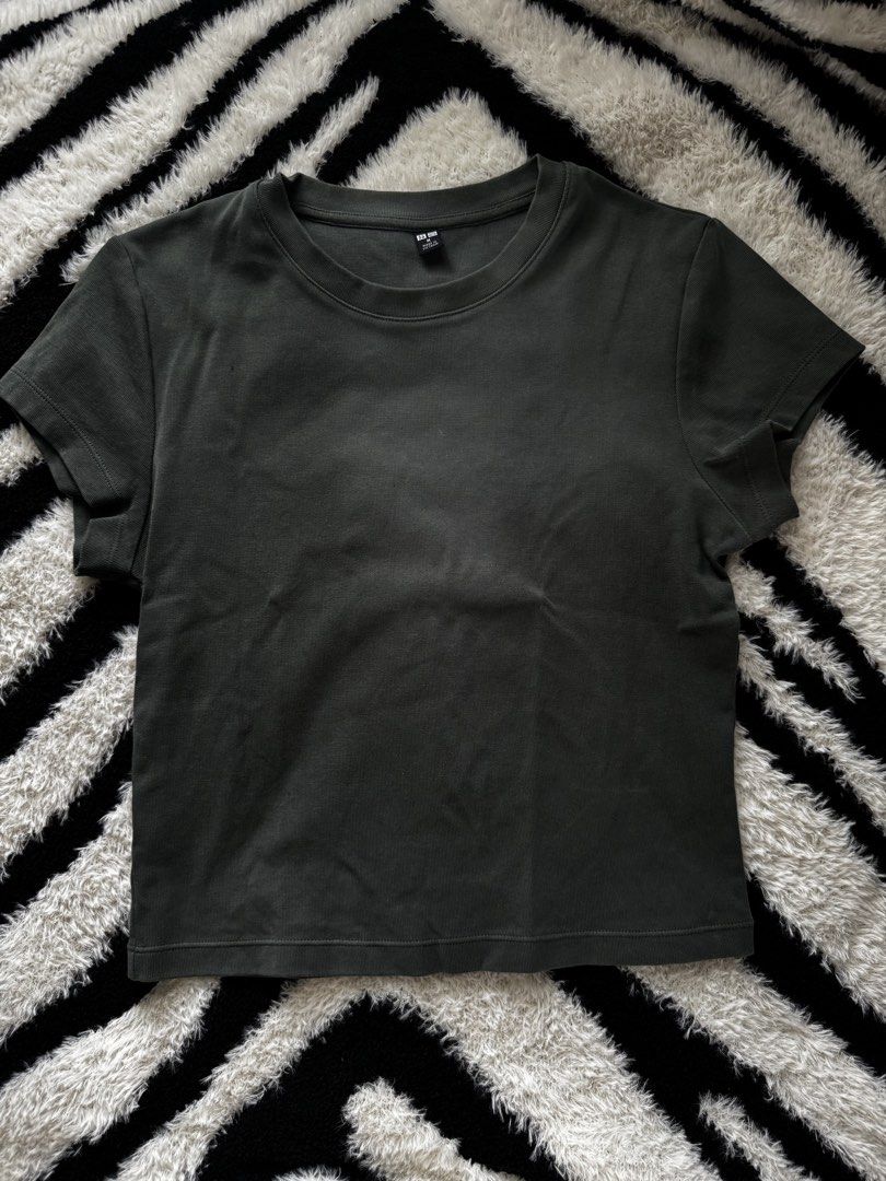 Uniqlo Olive Baby Tee (Category: Shirts) located in Dumaguete. Submitted by whimsyqueen03 (Listing ID 1440796932, Image 2). Description: • Dark green baby tee / muted olive tone • Soft, comfy & easy everyday staple • Minimal clean-girl / effortless vibe • Easy to pair with cargos, denim, skirts & basics • Closet essential piece ♡.