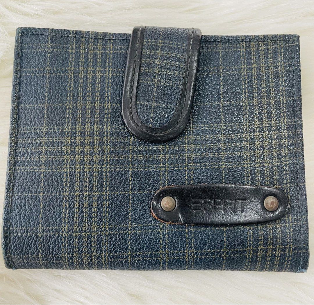 Vintage Esprit Plaid Bi-Fold Wallet (Category: Wallets & Card holders) located in San Juan City. Submitted by redrosierose (Listing ID 1440832743, Image 1). Description: - Esprit bi-fold wallet - Classic dark blue and tan plaid design - Secure snap closure - Multiple card slots and clear ID window inside - Compact and practical for everyday use - Shows some signs of wear, but fully functional -has signs of usage but unnoticeable RFS: Decluttering
