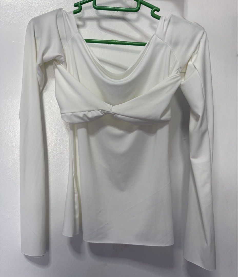 White Off-Shoulder Twist Front Long Sleeve Top (Category: Longsleeves) located in Manila. Submitted by kler_bear. (Listing ID 1440905814, Image 1). Description: NEVER been used - White long sleeve top - Off-shoulder neckline - Front twisted detail - Stretchy and comfortable material.