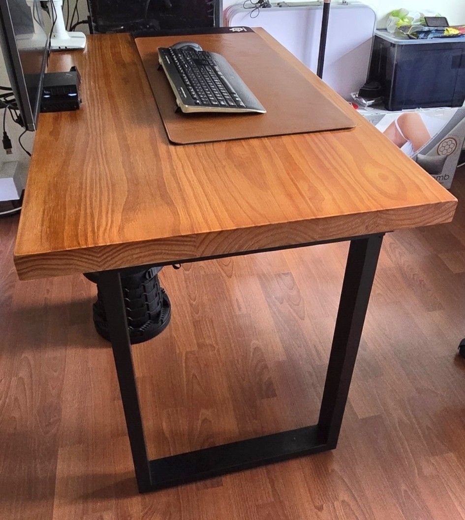 Solid Wood Table (Category: Tables & Sets) located in Singapore. Submitted by uwnwa96 (Listing ID 1440787011, Image 2). Description: - 120cm L x 70cm B x 75cm H - Bought for $400 1.5years ago. - Very Solid wooden desk with a warm, natural finish - 5cm thickness table top - Sturdy black metal legs - Ample surface space for computer and work - Ideal for home office or study or dining table. - Selling as I'm changing to bigger table - Selling only t