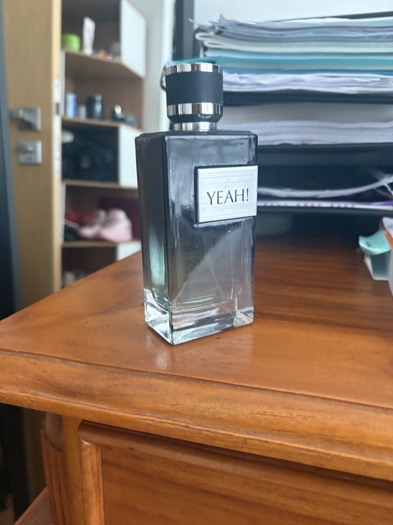 YEAH! Perfume for Men (Category: Fragrance & Deodorants) located in Singapore. Submitted by hooper09 (Listing ID 1440785317, Image 2). Description: - YEAH! Eau de Parfum - Masculine scent - Sleek black bottle with silver accents - Suitable for daily wear and special occasions - Bottle is mostly full.