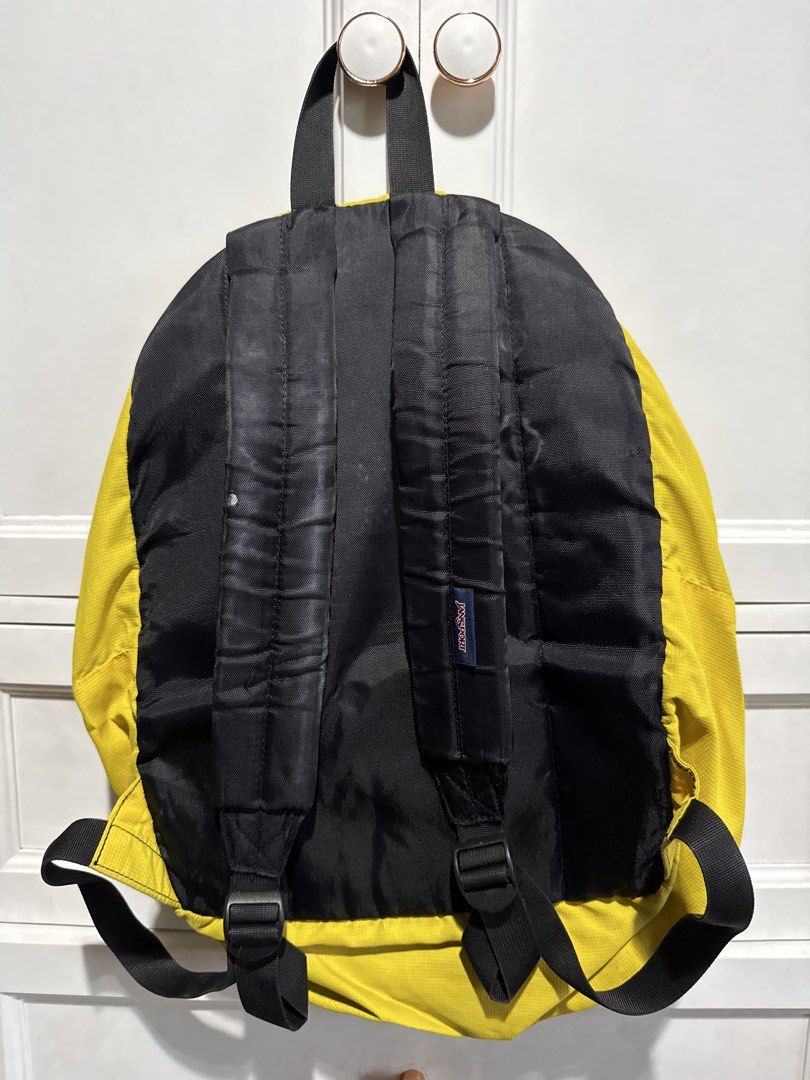 Yellow Jansport Backpack (Category: Backpacks) located in Quezon City. Submitted by itsbiancag (Listing ID 1440863976, Image 2). Description: Classic yellow Jansport backpack. Main compartment and front pocket. Straps are adjustable. Some marks on the back straps, check photos. Good for school or everyday use..