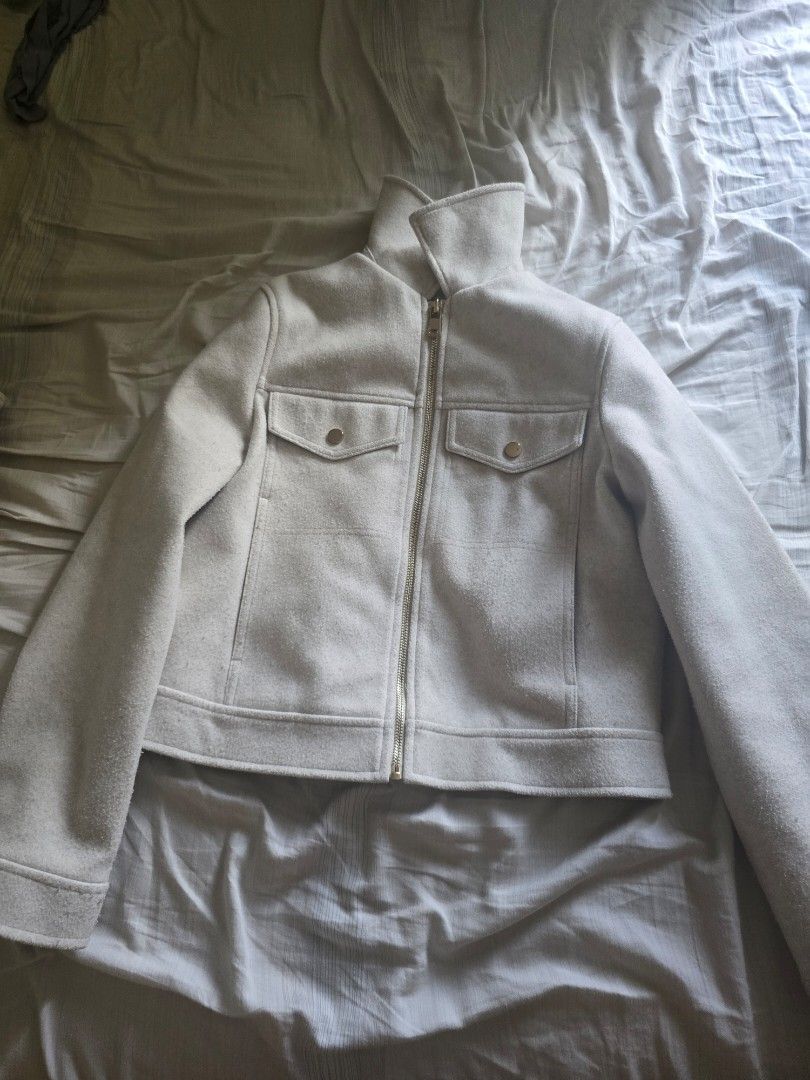 Zara Cream Wool Blend Zip Up Jacket (Category: Coats, Jackets and Outerwear) located in Manila. Submitted by quickforest-b05c (Listing ID 1440777196, Image 2). Description: - Zara cream jacket - Wool blend material - Zip-up front - Two chest pockets - High collar detail - Tag suggests size XS - Ideal for layering.