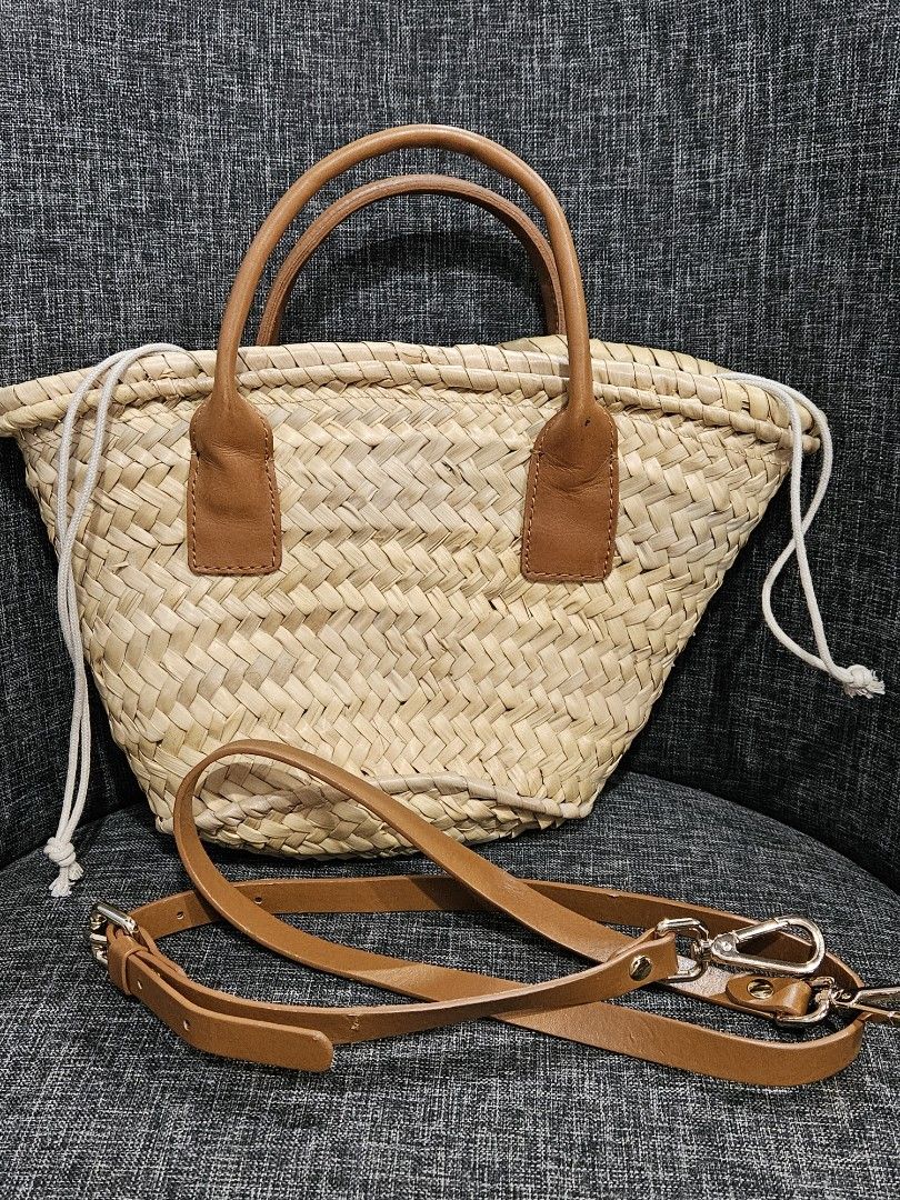Zara Straw Bag with Leather Handles and Strap (Category: Cross-body Bags) located in Muntinlupa City. Submitted by miss_d_ (Listing ID 1440844368, Image 1). Description: - Unused, only stored and personal item - Detachable leather strap included - Secure drawstring closure inside - Sf c/o buyer.