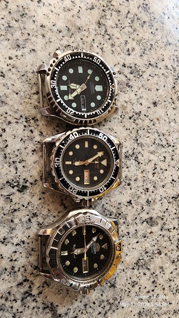 3x Automatic Watches - Seiko, Orient, Unknown (Category: Men's Watches) located in Caloocan City. Submitted by fernandezr29382 (Listing ID 1441054275, Image 2). Description: - Lot of 3 automatic watches - Brands include Seiko, Orient, and one with an 'S' or wave-like logo - All feature black dials - Rotating bezels on all watches - Visible wear on cases and all working .