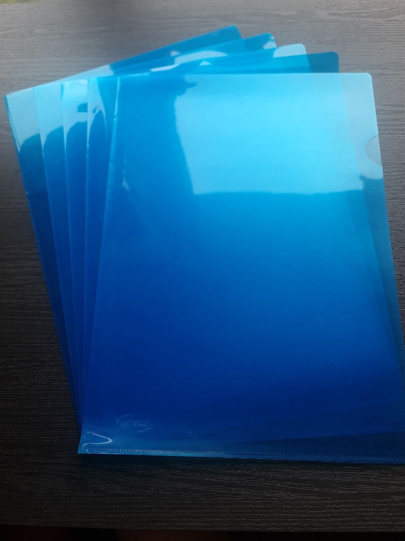 A4 L shape folder Blue (5 folders) (Category: Stationery & School Supplies) located in Singapore. Submitted by sc02980 (Listing ID 1441059410, Image 1). Description: - L-shaped for easy document insertion and removal. - Translucent material - Ideal for organizing papers and documents - Suitable for school or office use.