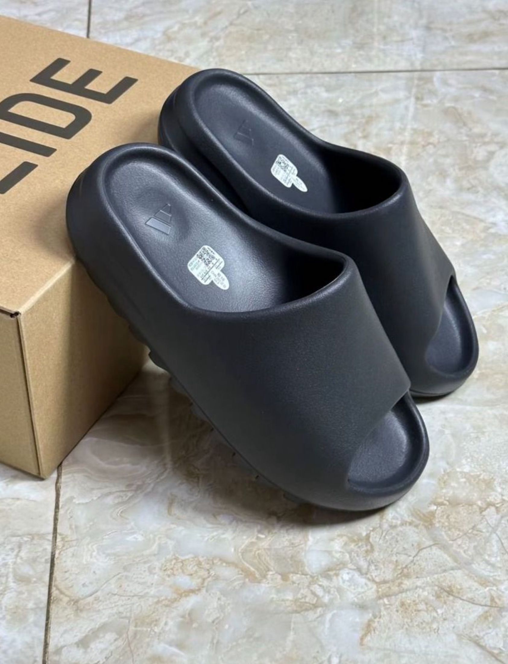 adidas originals Yeezy Slide Slippers Black (Category: Sneakers) located in Singapore. Submitted by muredolphin (Listing ID 1441087350, Image 2). Description: Hi! Adidas adidas originals Yeezy Slide Slippers Black now available 📢 ✅ Brand new 📸 Photos sent in ~3 days to confirm 🚛 Free shipping via J&T/Ninja Van 💰 Cash on delivery Chat me for sizes & availability 💬.