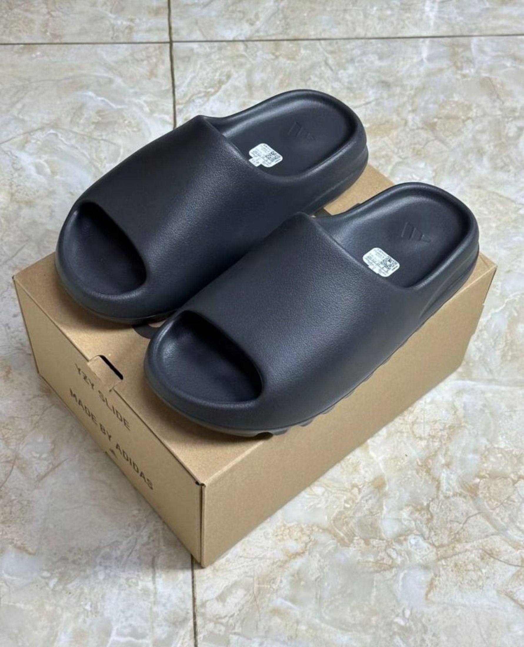 adidas originals Yeezy Slide Slippers Black (Category: Sneakers) located in Singapore. Submitted by muredolphin (Listing ID 1441087350, Image 1). Description: Hi! Adidas adidas originals Yeezy Slide Slippers Black now available 📢 ✅ Brand new 📸 Photos sent in ~3 days to confirm 🚛 Free shipping via J&T/Ninja Van 💰 Cash on delivery Chat me for sizes & availability 💬.
