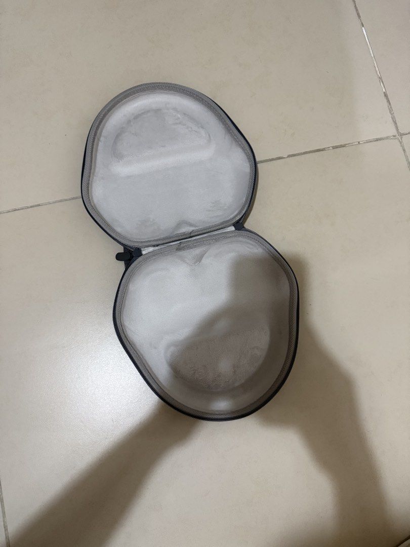 Airpods Max Grey Hard Shell Headphone Carrying Case with Handle (Category: Headphones & Headsets) located in Mandaluyong City. Submitted by mntssapdrns (Listing ID 1441119903, Image 2). Description: - Grey hard shell case for headphones - Sturdy zipper closure - Convenient carrying handle - Soft and padded interior for protection - Fits most over-ear headphone models - Perfect for travel and safe storage.