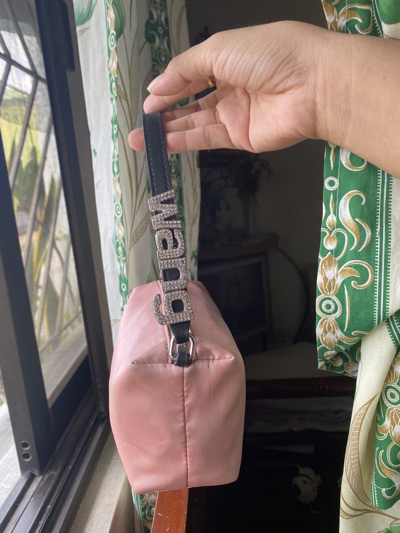 Alexander Wang Pink Satin Shoulder Bag with Rhinestone Logo (Category: Luxury Bags & Wallets) located in Cavite. Submitted by rmquin05 (Listing ID 1440986721, Image 3). Description: - Cute pink shoulder bag - Features Alexander Wang logo in rhinestones on the strap - Made of satin material - Four metal feet on the bottom - Zipper closure - Small size, ideal for carrying essentials.
