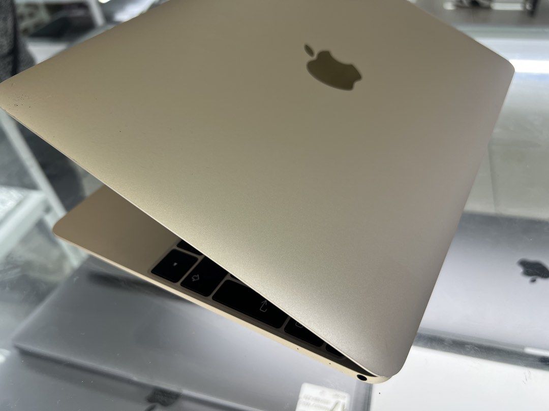 Apple MacBook 12-inch Gold (Category: Laptops & Notebooks) located in Manila. Submitted by vaniextura (Listing ID 1441133835, Image 3). Description: - Gold Apple MacBook 12-inch -memory 8gb -storage 195 - Ideal for everyday tasks and portability - Nordic (Swedish/Finnish) keyboard layout - Bright and clear screen - Minor exterior scuffs from normal use - Battery charges fine (photo shows low charge) - Features a USB-C port.