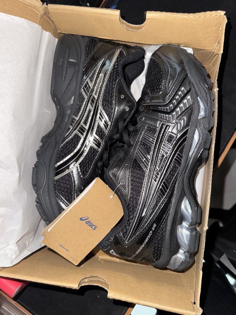ASICS Gel-Kayano 14 Black Silver Running Shoes (Category: Sneakers) located in Singapore. Submitted by repstudio (Listing ID 1441022833, Image 3). Description: - ASICS Gel-Kayano 14 - Colorway: Cream/Black - Size: Men's US 9.5 / Women's US 11 - Condition: Excellent, with original box - Features: Comfortable, supportive - Ideal for: Running, everyday wear.
