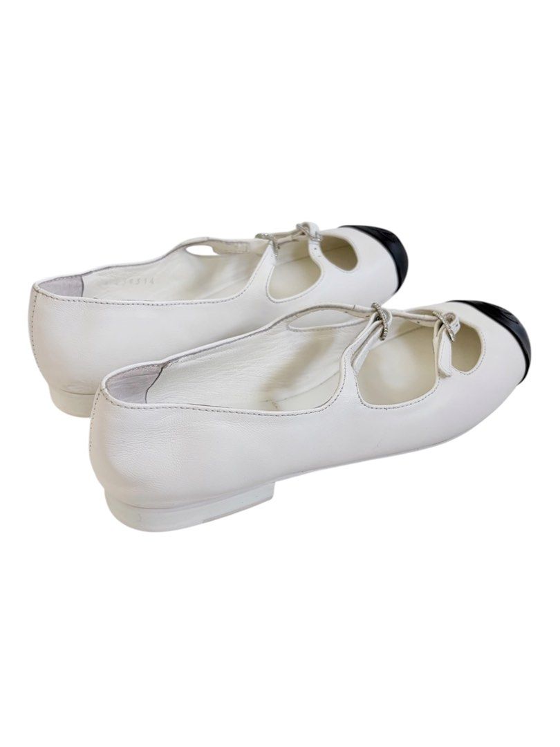 Authentic CHANEL Mary Jane Flats (Category: Sneakers & Footwear) located in Manila. Submitted by serendipitymanila (Listing ID 1441044578, Image 3). Description: - Classic Chanel flats - White leather with black cap toe - Iconic Chanel logo on toe - Adjustable ankle straps with buckle closure - Comfortable and stylish for everyday wear - A great addition to any wardrobe.