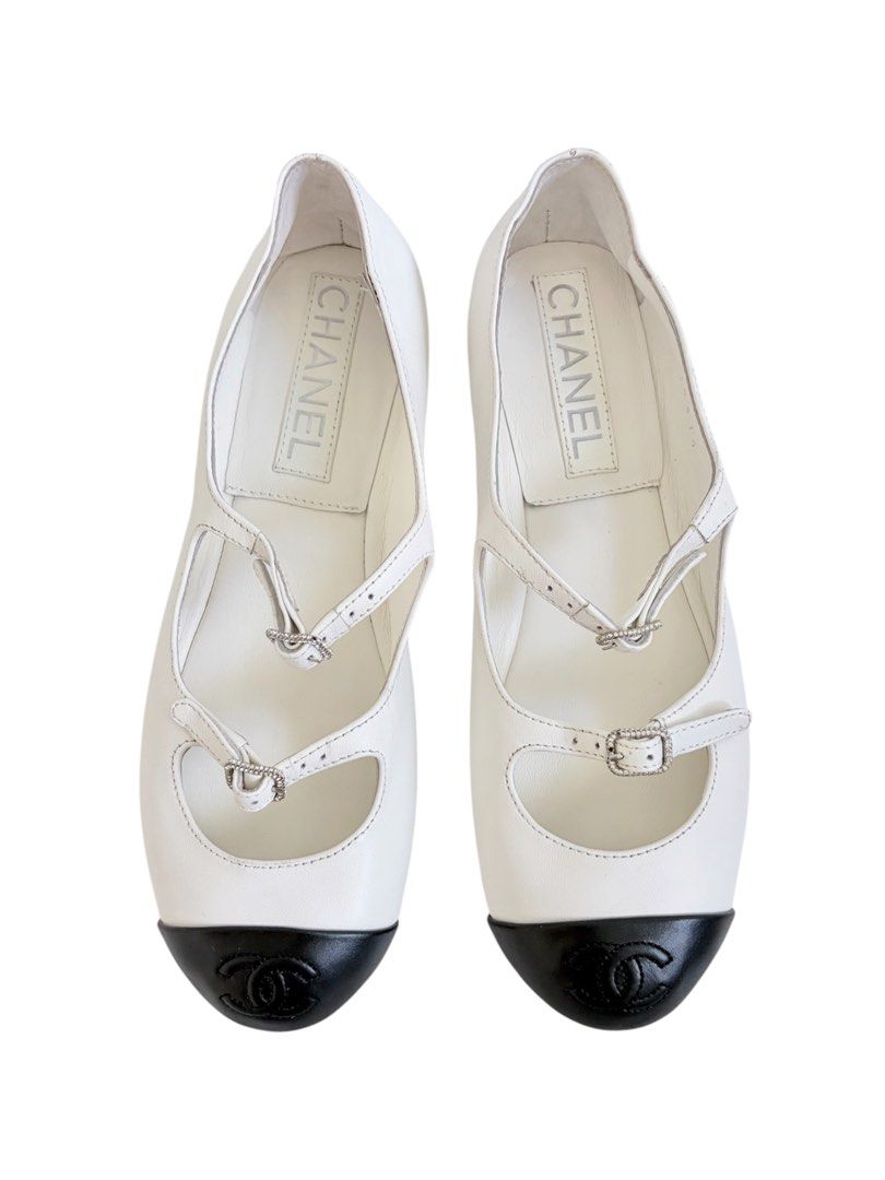 Authentic CHANEL Mary Jane Flats (Category: Sneakers & Footwear) located in Manila. Submitted by serendipitymanila (Listing ID 1441044578, Image 2). Description: - Classic Chanel flats - White leather with black cap toe - Iconic Chanel logo on toe - Adjustable ankle straps with buckle closure - Comfortable and stylish for everyday wear - A great addition to any wardrobe.
