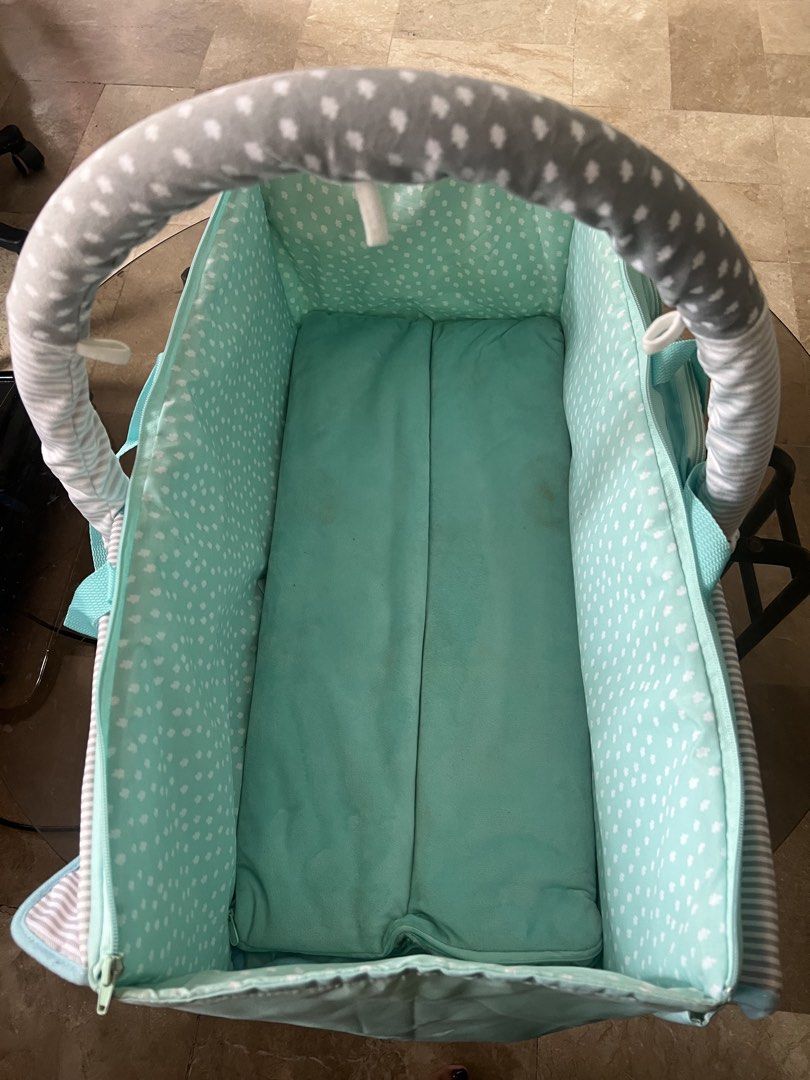 Baby Bassinet with Carry Bag (Category: Cots & Cribs) located in Quezon City. Submitted by charlenedv58782 (Listing ID 1441114591, Image 3). Description: • Soft padded interior for baby’s comfort • Lightweight and portable with carry handles • Foldable design with zipper sides for easy storage • Multiple exterior pockets for baby essentials • Cute mint green, gray, and white pattern • Suitable for newborns and young infants Condition: Gently used