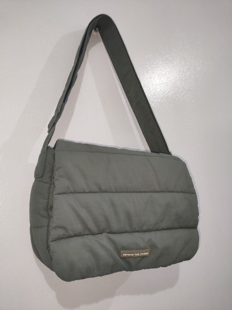 Beyond The Vines Poofy Shoulder Bag (Category: Shoulder Bags) located in Quezon City. Submitted by maxsab (Listing ID 1441083410, Image 3). Description: - Beyond The Vines Khaki Puffer Shoulder Bag - Soft and squishy material for ultimate comfort - Adjustable strap for a customized fit - Vibrant bright blue interior lining - Ample space for all your daily essentials - Ideal for everyday use.