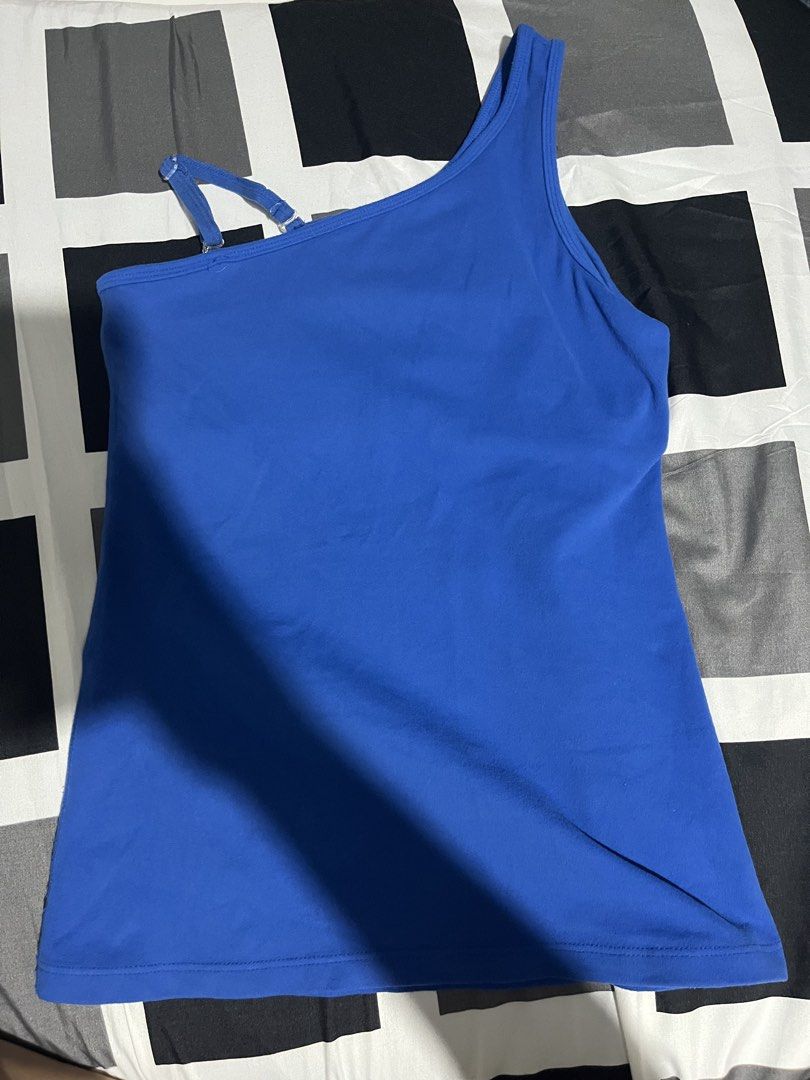 Beyond Yoga Blue One Shoulder Tank Top (Category: Activewear) located in Manila. Submitted by hi_abbd (Listing ID 1440971922, Image 1). Description: - Beyond Yoga blue one-shoulder tank top - Features an adjustable strap - Inner slogan: 'i am beyond... motivated' - Ideal for yoga and workouts - Comfortable and stylish design.