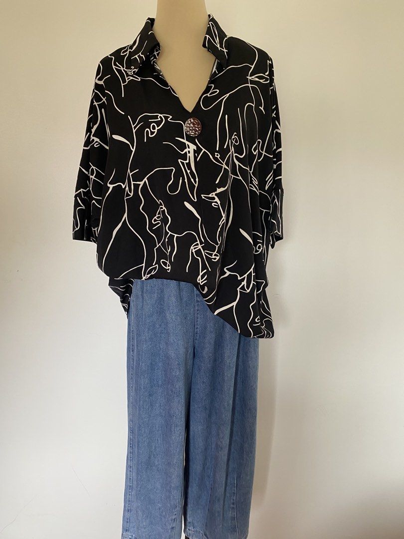 Black & White Abstract Face Print Oversized Top with Brooch (Category: Others Tops) located in Santa Rosa. Submitted by summerbrunch (Listing ID 1440959954, Image 3). Description: MANNEQUIN BODY SIZE: Medium Super nice oversized top Can fit med-large Medium for an oversized fit - Cool black top - Unique abstract face print - Relaxed, oversized fit - Wide sleeves - Decorative brooch at neckline - Easy to pair with jeans or trousers - Makes a state