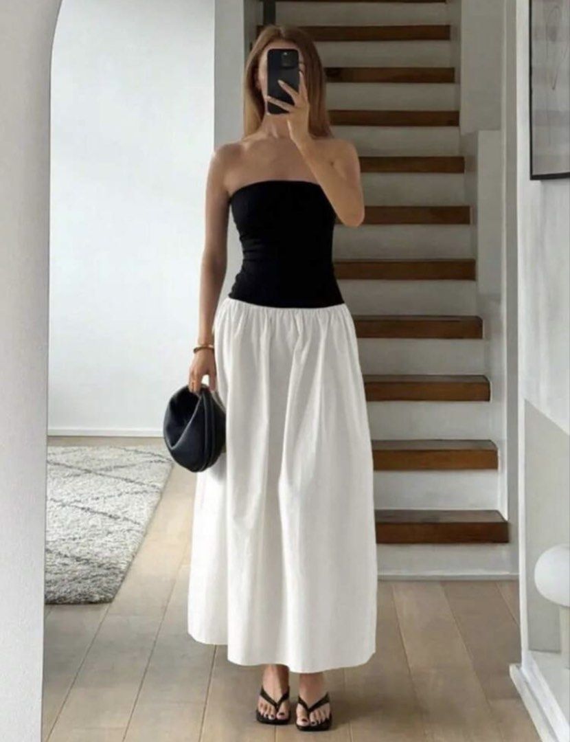 Black and White Strapless Maxi Dress (Category: Dresses) located in Pasig City. Submitted by hobbesthetiger (Listing ID 1441074500, Image 3). Description: - Two-piece look dress - Black strapless top - White flowy maxi skirt - High-waisted design - Ideal for summer events or casual outings - Comfortable and stylish - Versatile for dressing up or down.