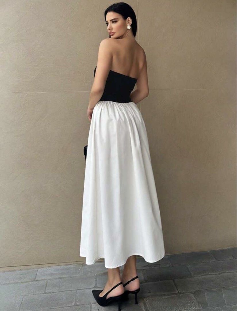 Black and White Strapless Maxi Dress (Category: Dresses) located in Pasig City. Submitted by hobbesthetiger (Listing ID 1441074500, Image 2). Description: - Two-piece look dress - Black strapless top - White flowy maxi skirt - High-waisted design - Ideal for summer events or casual outings - Comfortable and stylish - Versatile for dressing up or down.