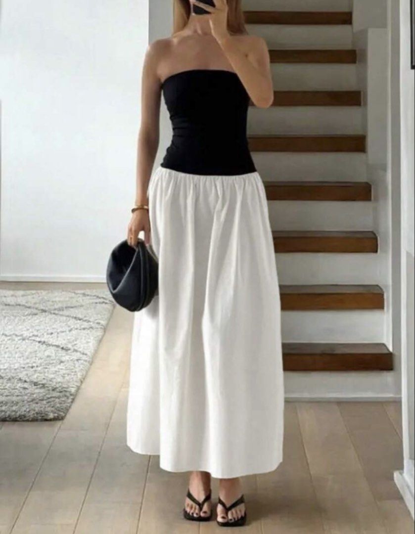 Black and White Strapless Maxi Dress (Category: Dresses) located in Pasig City. Submitted by hobbesthetiger (Listing ID 1441074500, Image 1). Description: - Two-piece look dress - Black strapless top - White flowy maxi skirt - High-waisted design - Ideal for summer events or casual outings - Comfortable and stylish - Versatile for dressing up or down.