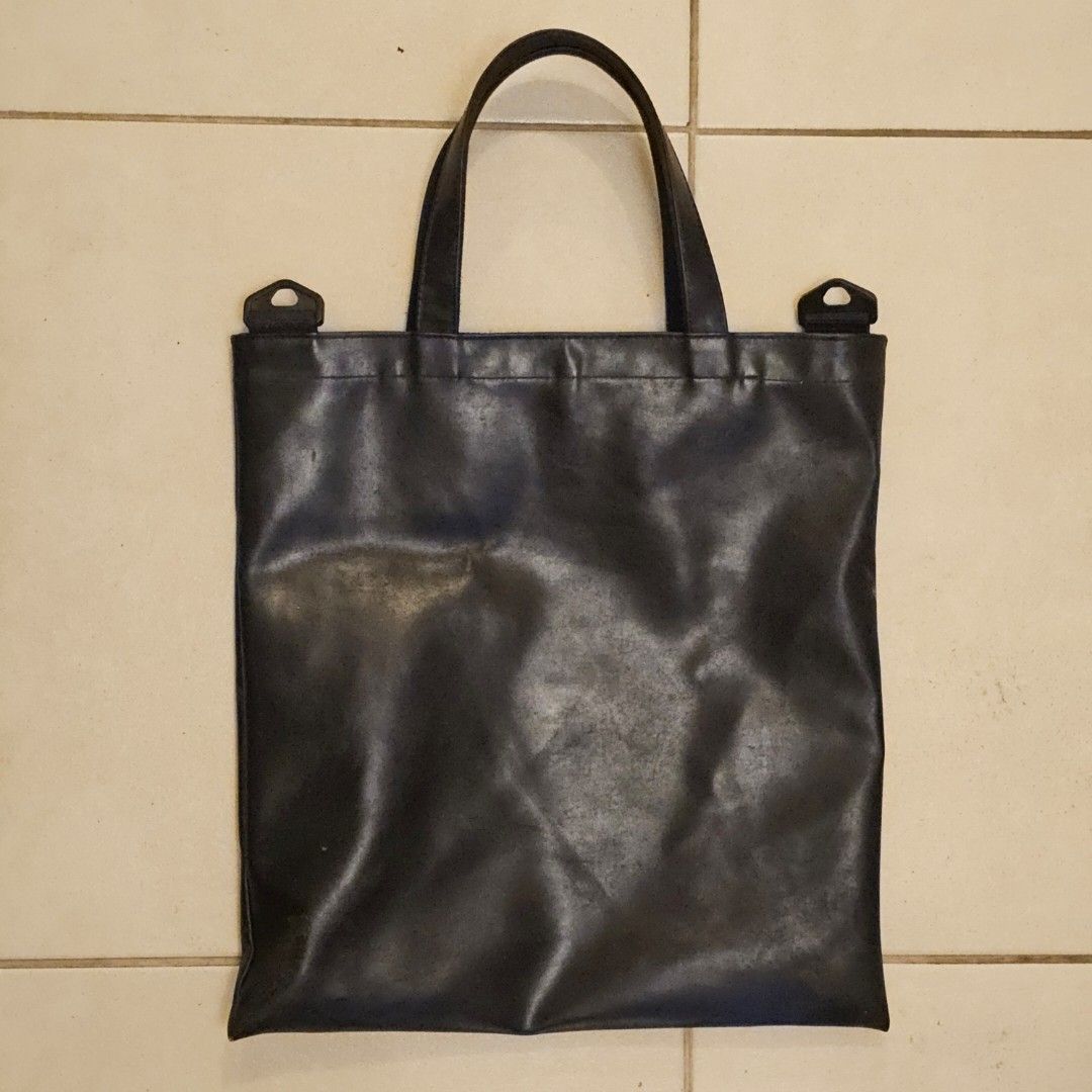 Black Pleather Tote Bag Laptop Bag (Category: Luxury Bags & Wallets) located in Silang. Submitted by monpeanut (Listing ID 1441027238, Image 2). Description: - Spacious main compartment - Approximate measurements: 16 inches tall, 15.5 inches wide - Handle drop: approximately 7 inches.