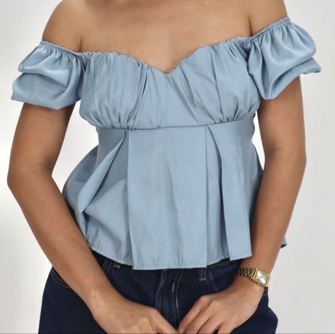 Blue Off-Shoulder Peplum Top (Category: Blouses) located in Manila. Submitted by clairdeclutters (Listing ID 1441086270, Image 1). Description: - Puff sleeves - Pairs well with jeans or skirts - Can fit medium up to large frame - Very flattering - Can send more pics :) - Message me for any inquiries!.