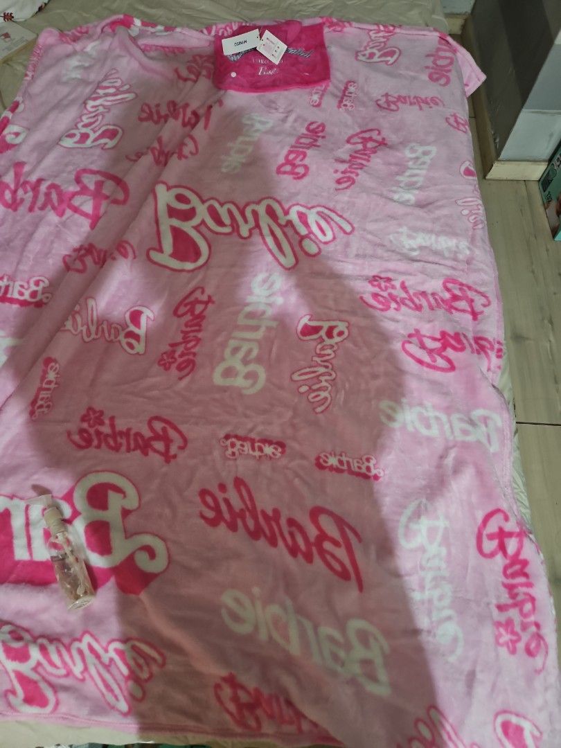 BNWT Barbie Pink Foldable Blanket with Handle and Pouch (Category: Bedding & Towels) located in Manila. Submitted by preloved.christine (Listing ID 1441074291, Image 3). Description: - Adorable Barbie blanket - Pink with all-over Barbie logo print - Folds into a compact pouch with a handle - Ideal for picnics, travel, or cozy lounging - Made from soft and cozy material - A must-have for any Barbie enthusiast!.