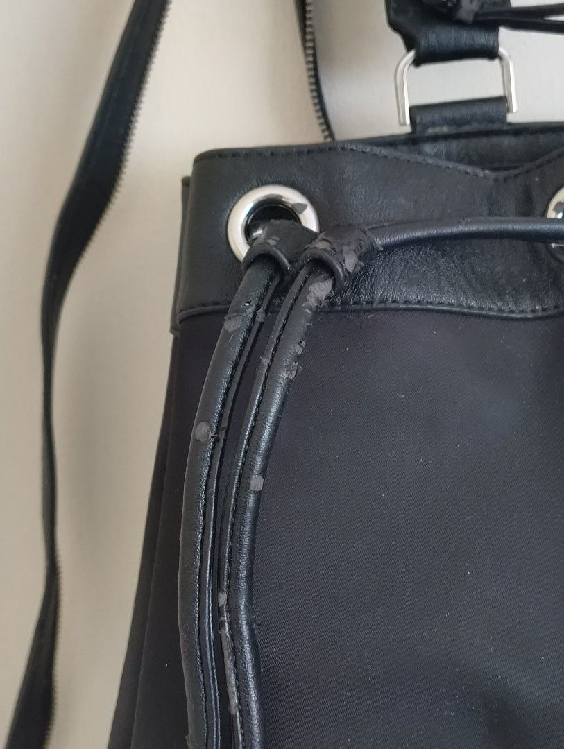 Calvin Klein Black Drawstring Bucket Backpack (Category: Backpacks) located in Quezon City. Submitted by afteruse (Listing ID 1440973861, Image 3). Description: - Bought by relatives in the US as a gift - Convertible strap at the back - Used 3x lang 🥲 - PU leather was already flaking on 1st use 😭 wtf - Sayang talaga because the hardware and the nylon body is durable and of good quality. 🥲🥲🥲 yung pu lang talaga 🥲 Similar listing on Poshmark: