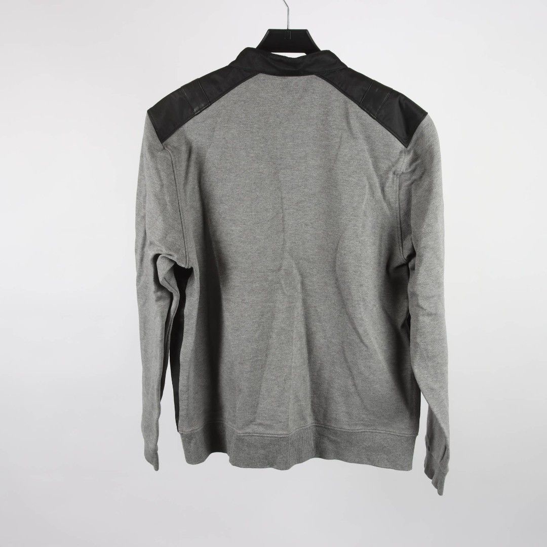 Calvin Klein Men's Grey & Black Bomber Jacket Size L (Category: Coats, Jackets and Outerwear) located in Santa Cruz. Submitted by jm.co (Listing ID 1440952072, Image 2). Description: - Brand: Calvin Klein - Color: Grey and Black - Style: Bomber Jacket - Features: Zip-up front, long sleeves, stand-up collar - Material: Cotton blend - Size: L - Occasion: Casual wear.